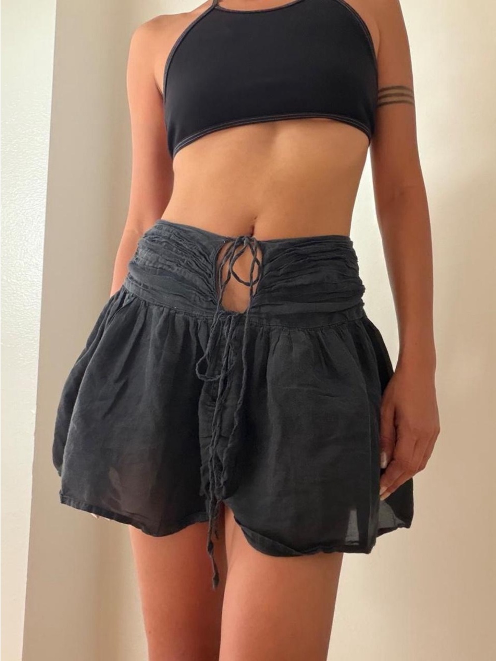 Gimaguas Black Ruched Tie Mini Skirt Low Rise Cut Out